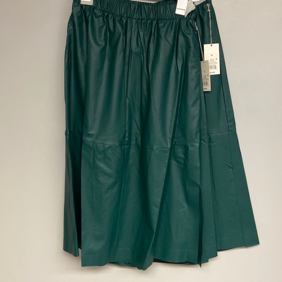 a new day Dresses & Skirts - Size small and Medium bundle. Green Faux Leather skirts. Great for Christmas